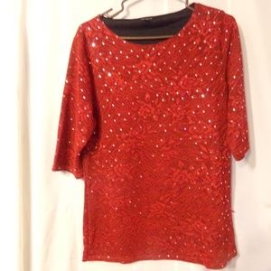 Red blouse with silver shiny dots.